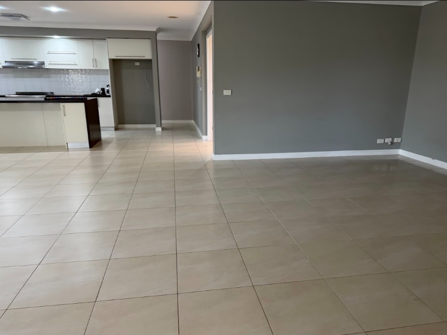 clean tiled open-plan kitchen and living area after end of lease cleaning in geelong